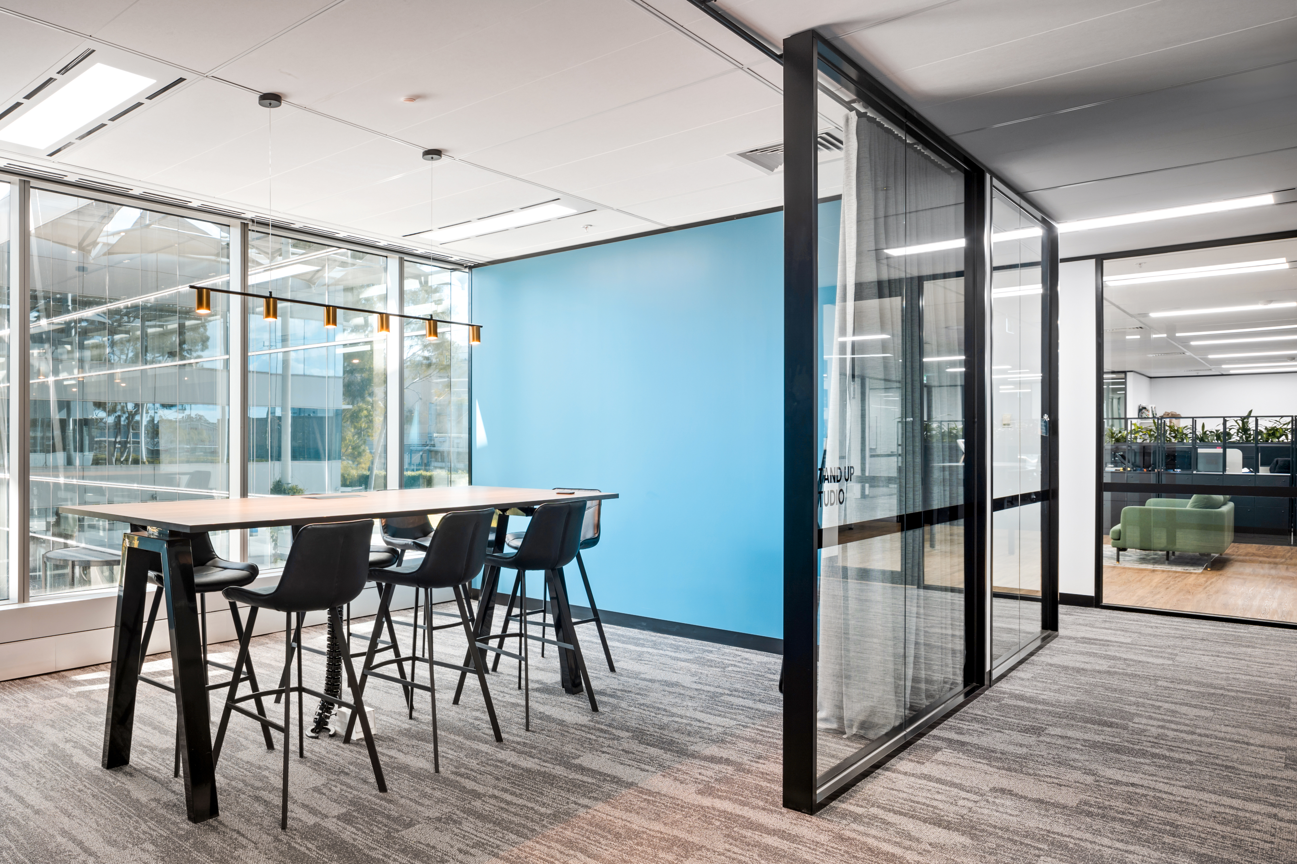 Glass-partitioned meeting room in a commercial office fitout by AFS